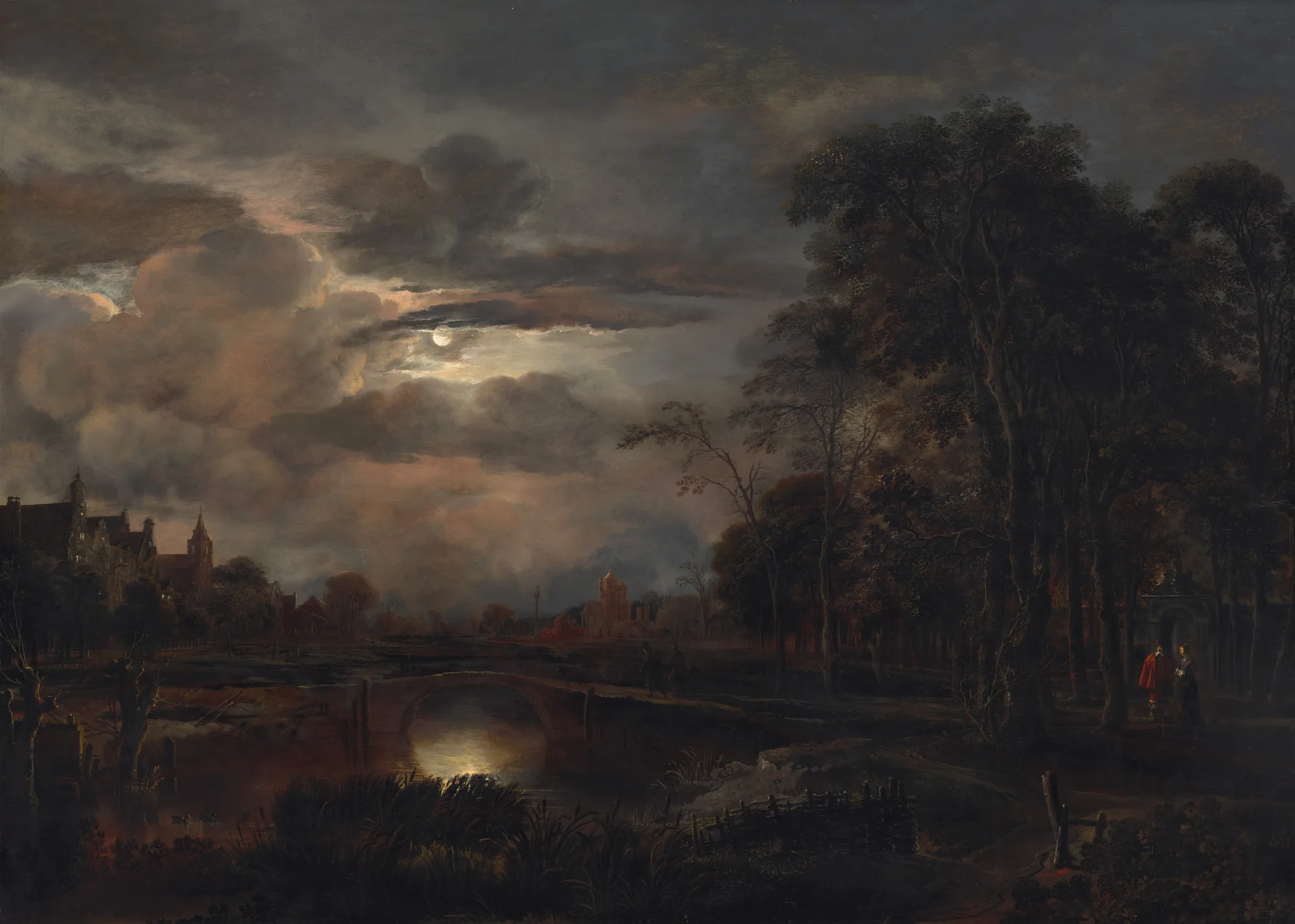 In almost complete darkness, we look across reeds and grasses lining a river spanned by narrow, arched, stone bridge ahead of us in this moonlit, horizontal landscape painting. The horizon comes about a third of the way up the painting, just over the footbridge, and the sky is filled with clouds that glow blush pink, flint gray, and lavender purple. The small, porcelain-white moon casts an opalescent gleam on the water under the arch of the bridge. Barely visible in the gloom, a walking path lined by a fence in the lower right corner leads to a copse of tall trees to our right. Closer inspection reveals a man wearing crimson red and a woman wearing pine green standing together near the gate of a walled enclosure beyond the trees. Moonlight glints on their white collars and cuffs, and on the gold buttons and embroidery on their clothing. Spires and buildings with stepped rooflines along the riverbank are outlined against the illuminated sky, though most of the details of the structures are swallowed in shadow. 